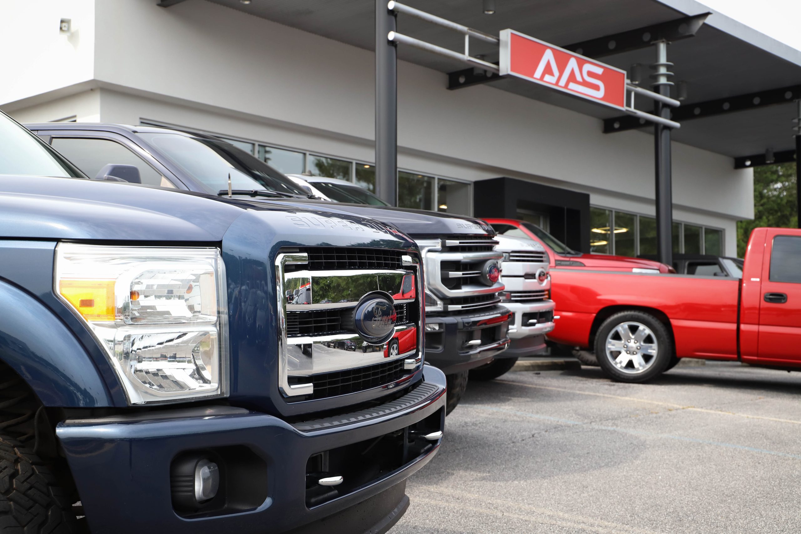 Customized Trucks in Front of Athens Auto Sports
